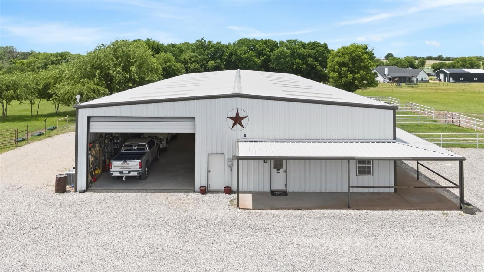 Hangar front with lone star and open bay doors
